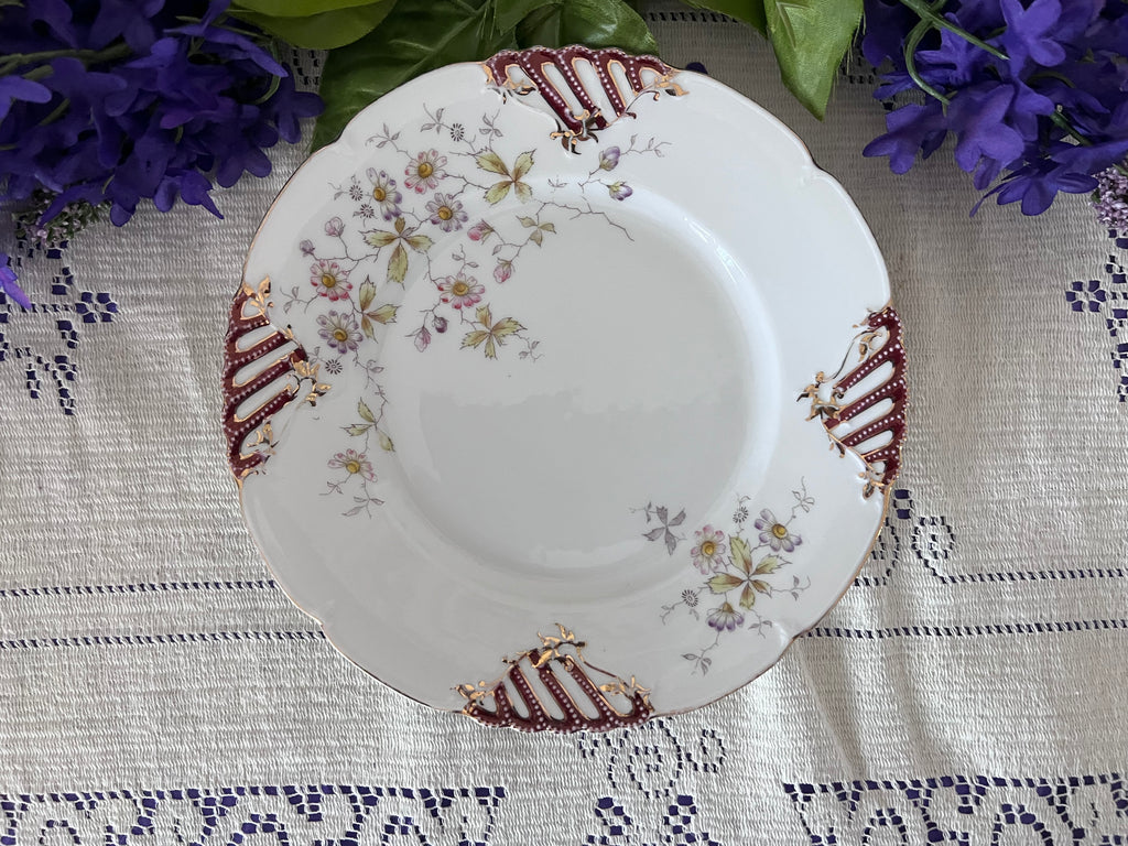 Antique German Porcelain Cabinet Plate – Pierced Burgundy & Gold Lattice Rim – Delicate Wildflower Floral Spray – Hand-Painted "QQ" Mark