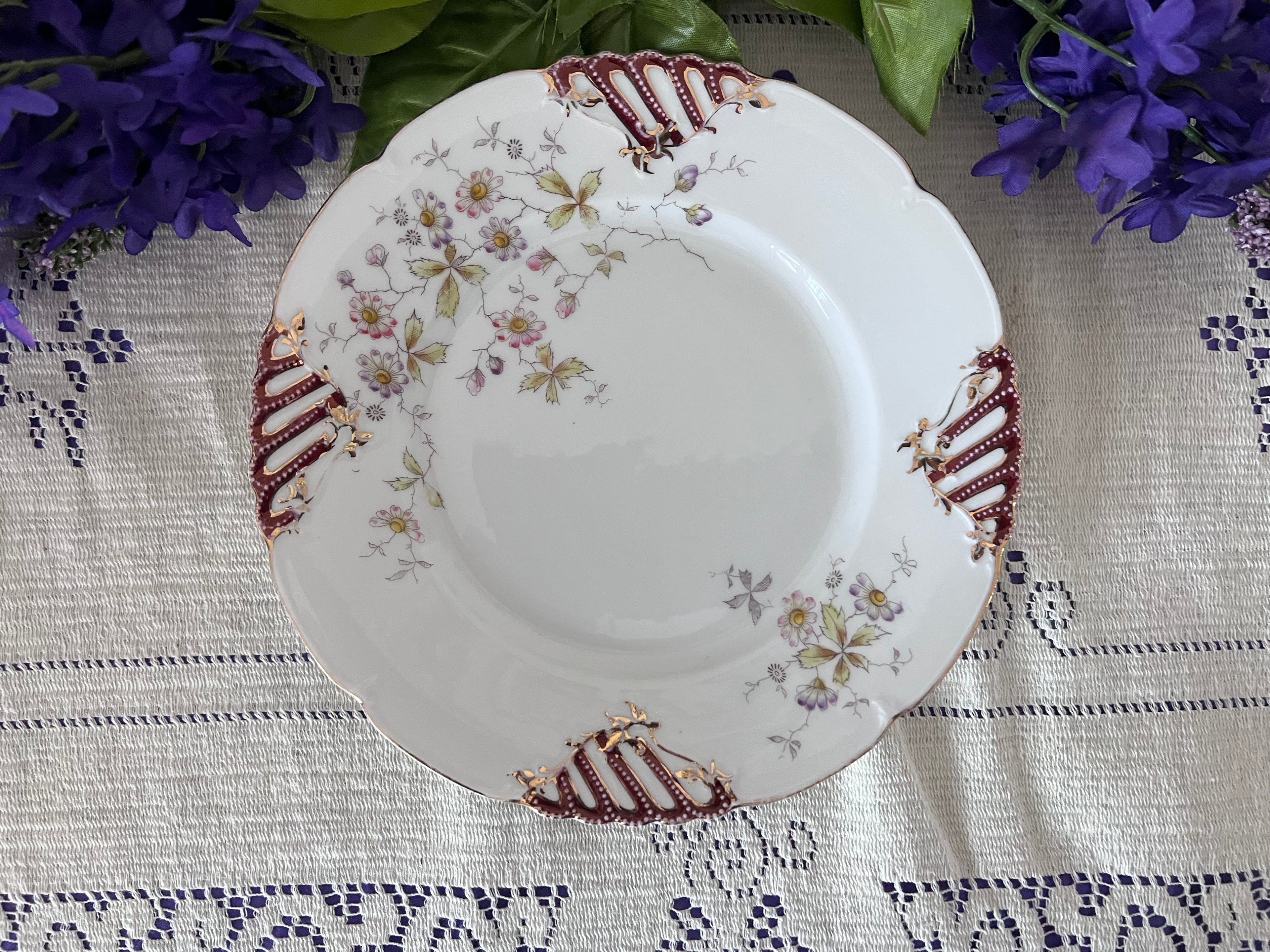 Antique German Porcelain Cabinet Plate – Pierced Burgundy & Gold Lattice Rim – Delicate Wildflower Floral Spray – Hand-Painted "QQ" Mark