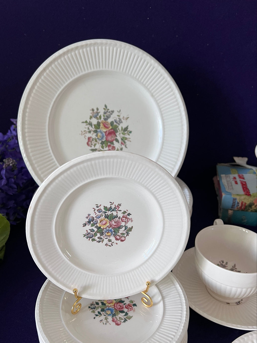 Set of decorative plates with floral patterns on a dark surface